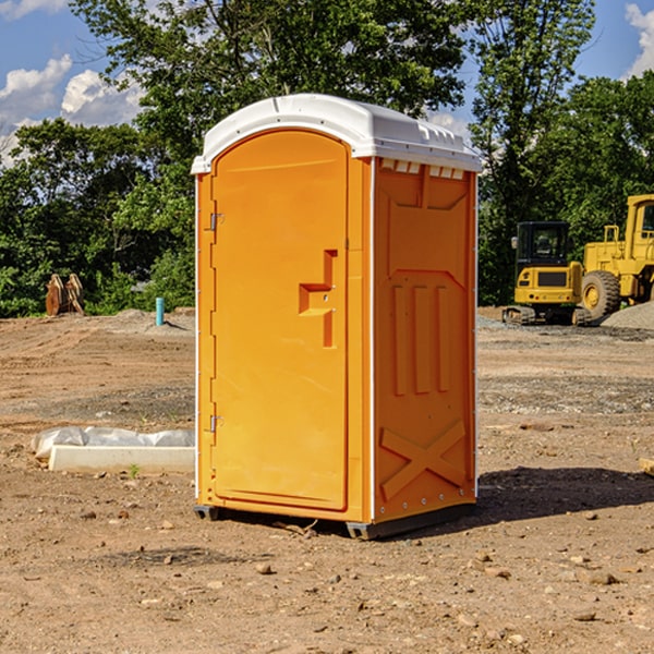 what is the cost difference between standard and deluxe portable restroom rentals in Montague